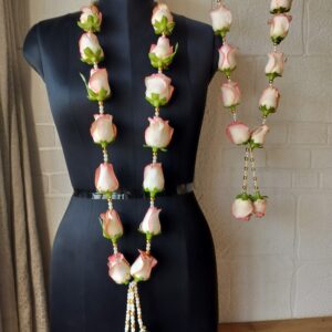 Blush pink and white rose varmala with pearl and golden bead accents for a romantic wedding.