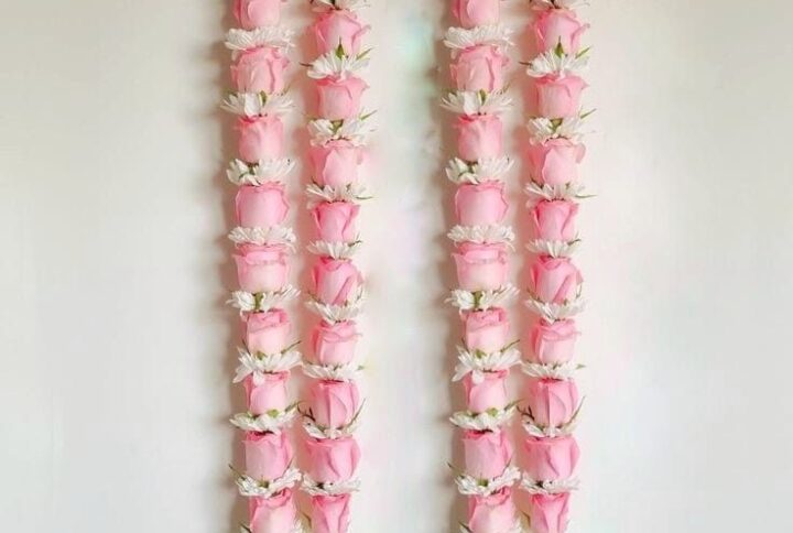 aby pink rose and white Sevanthi varmala – a dreamy floral garland for weddings.