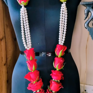 Red rose and white pearl varmala – a luxurious and elegant wedding garland.