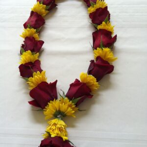 Red rose and yellow Sevanti varmala – a bright and auspicious wedding garland.