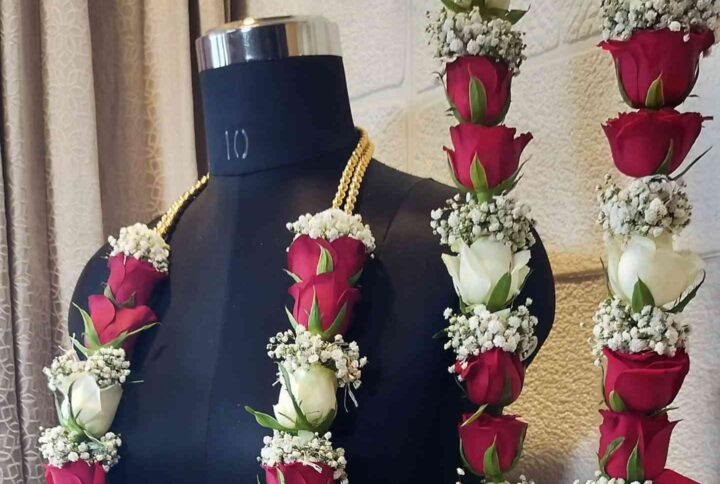 Red and white roses with baby breath flowers