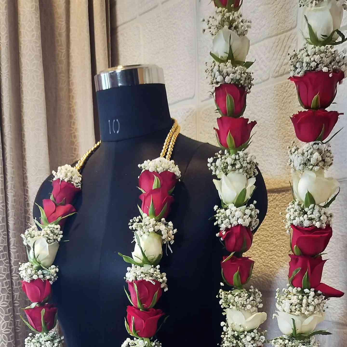 Red and white roses with baby breath flowers